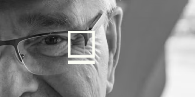 Close-up monochrome portrait of an older man with the Blank Boxx square mark overlaid
